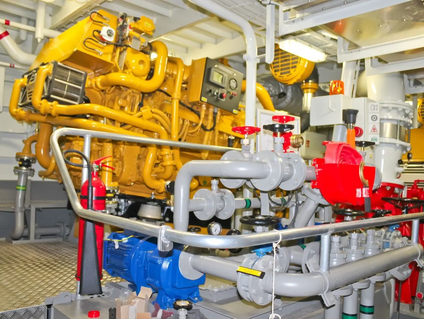Ship engine room with AI visual inspection monitoring turbines, engine parts, and mechanical components in real-time for predictive maintenance