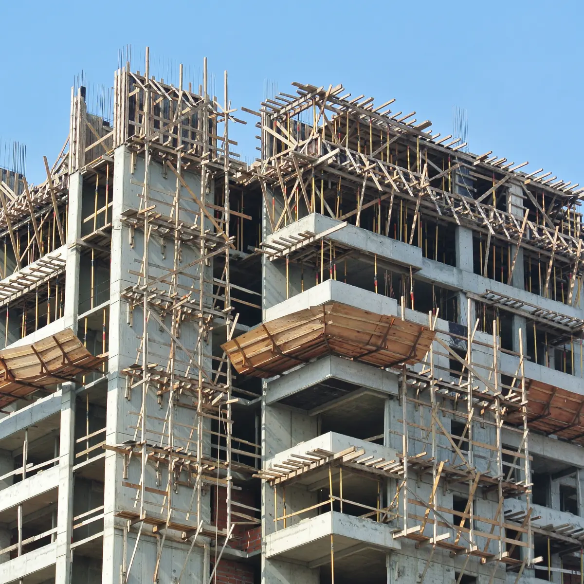 Landscape view of power line corridors with monitoring infrastructure, enabling AI-based inspection of transmission assets.