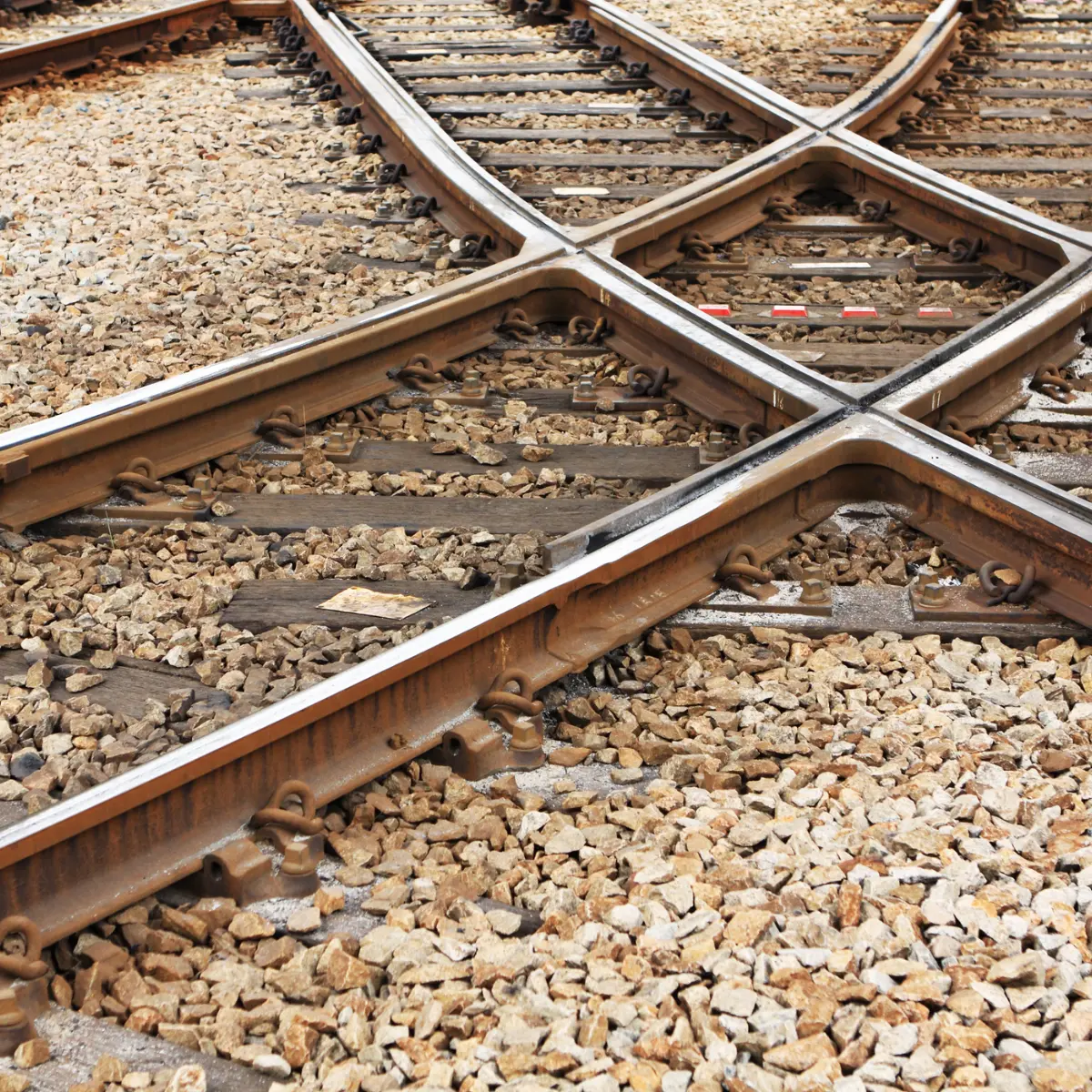 Drone-based inspection of train tracks and rail infrastructure, detecting alignment issues and surface wear for transportation safety.