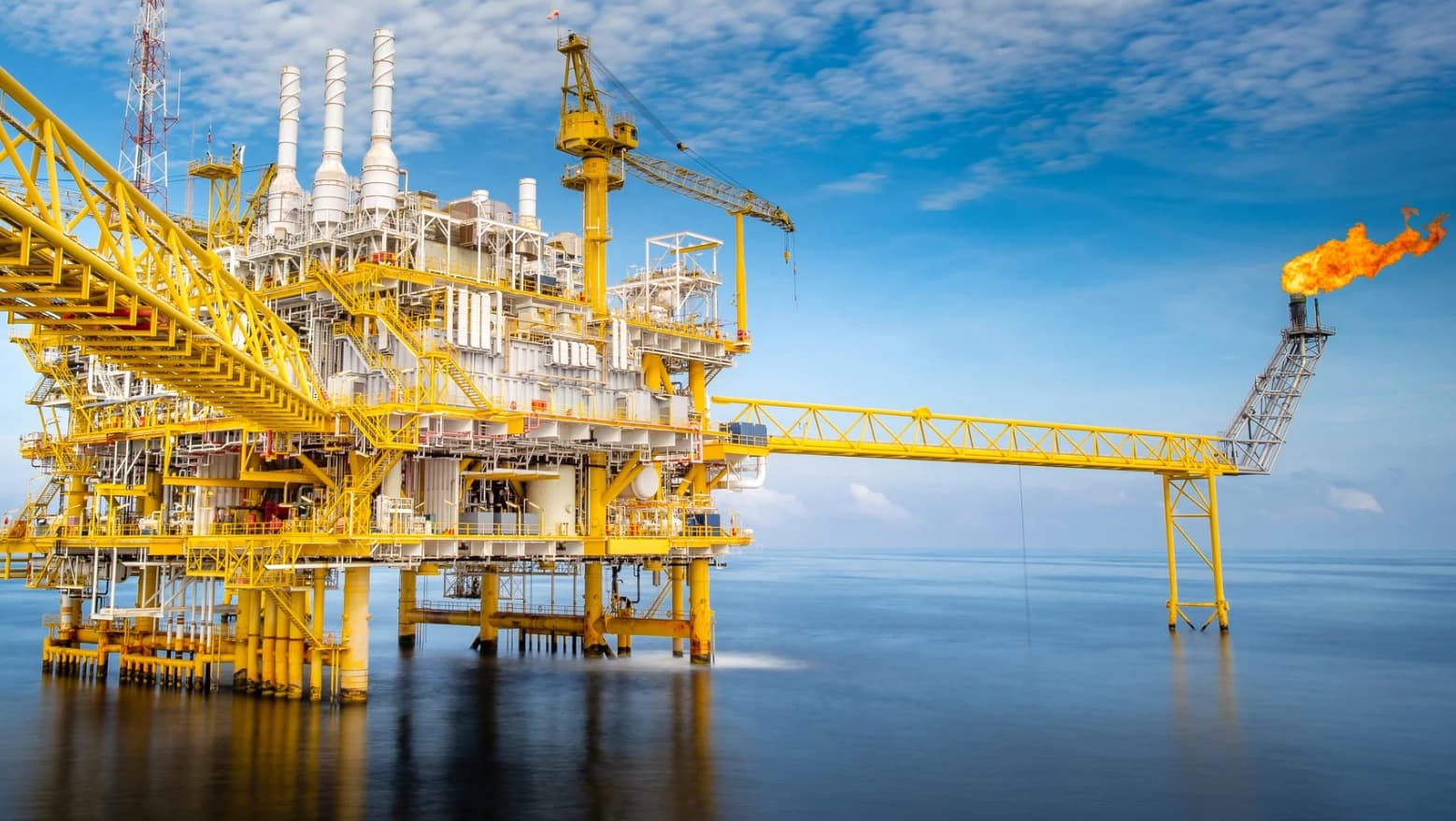 Oil and gas facility at dusk with inspection drone highlighting pipeline corrosion using AI bounding box overlay