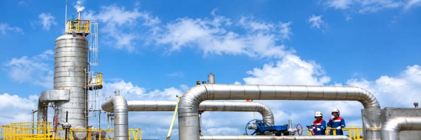 Engineer inspecting a rusty pipe in an industrial setting, demonstrating real-world infrastructure inspection use case.